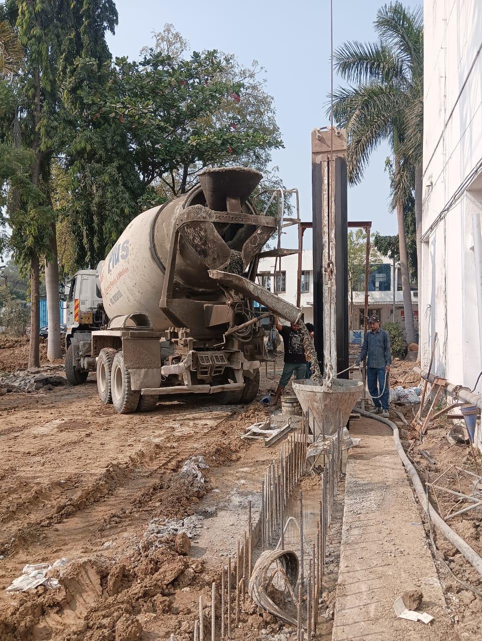 Concrete mixer and wall construction work at Jayaben Mody Hospital